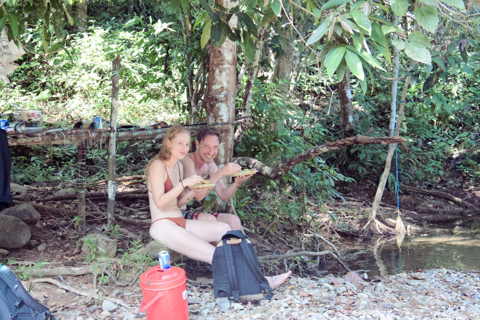 Couple enjoying freshly cooked lunch by the Jungle Bar at the freshwater pool
